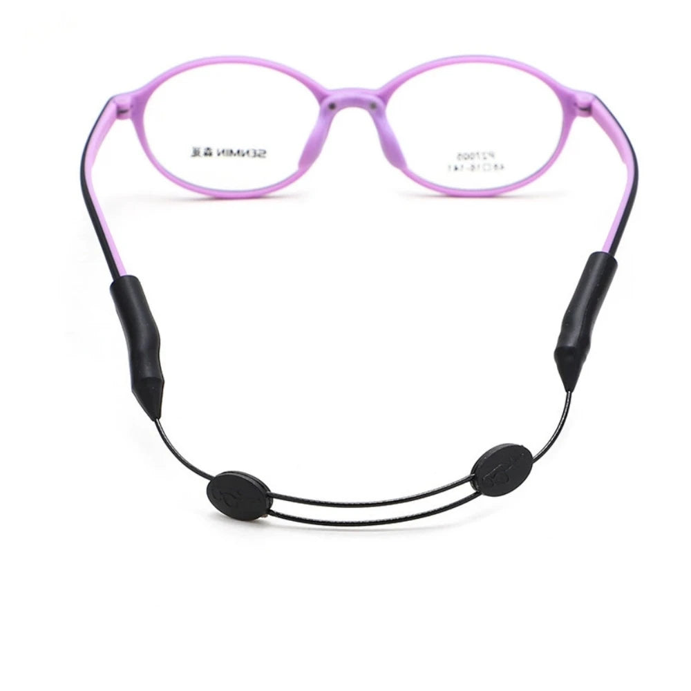 A pair of pink universal adjustable eyewear retainer glasses with black silicone straps.