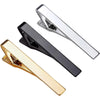 Three elegant men's tie clips in silver, black, and gold displayed against a white background.