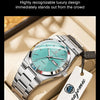 A silver luxury men's waterproof quartz wristwatch with a teal dial is displayed in a light-colored box.