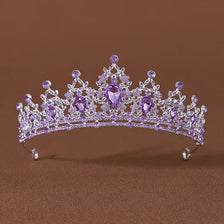 A delicate lavender crystal tiara headband featuring purple gemstones and intricate silver-toned metalwork.