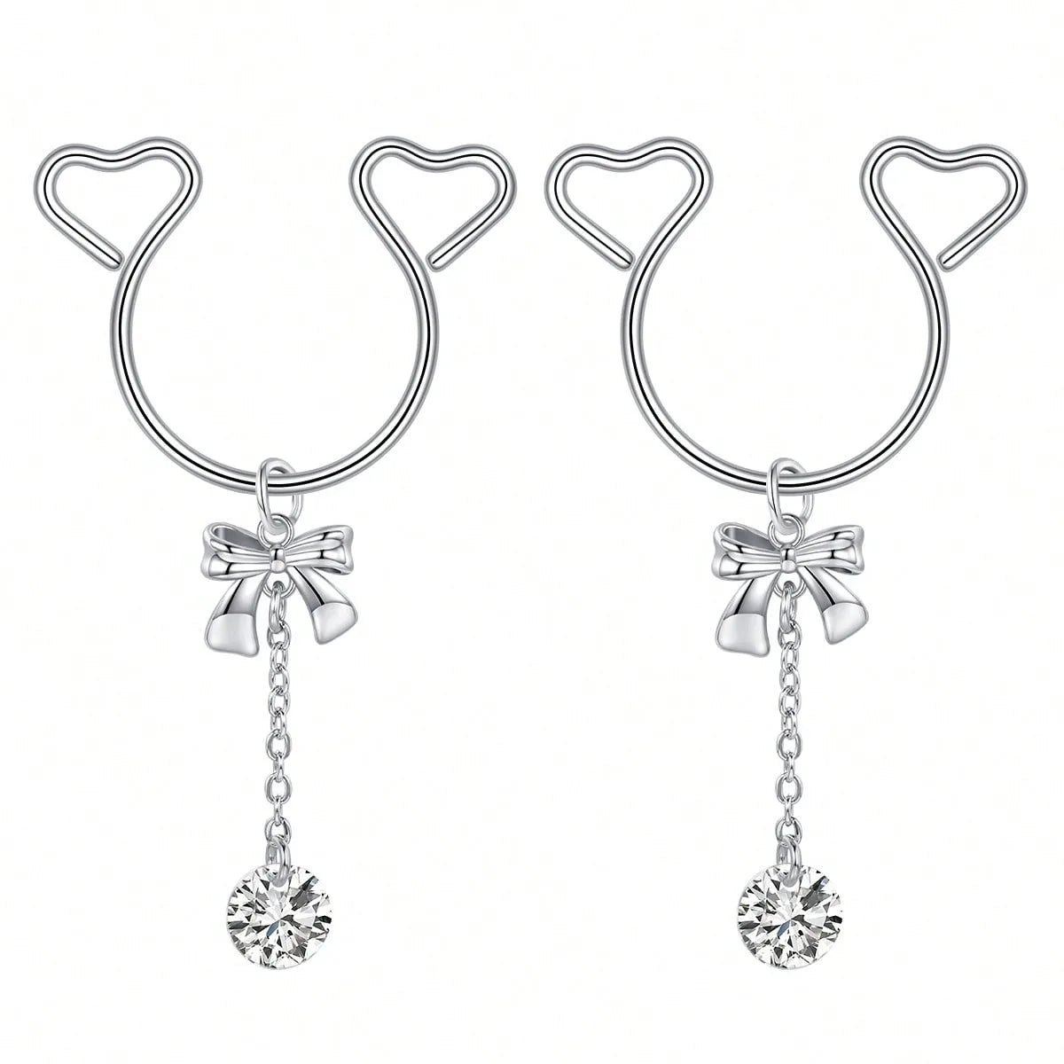 A pair of silver heart dangle non-piercing nipple rings with cubic zirconia stones.