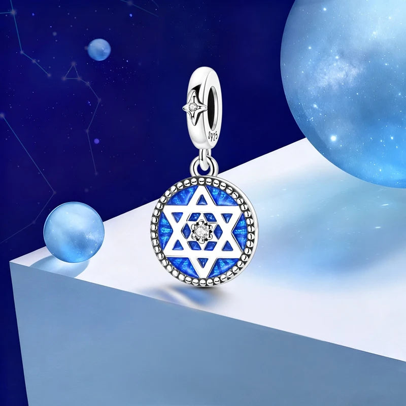 Sterling silver star moon charm bracelet featuring a pendant with a Star of David design