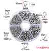 A circular plastic container holding various silver jewelry findings including clasps, hooks, and jump rings.