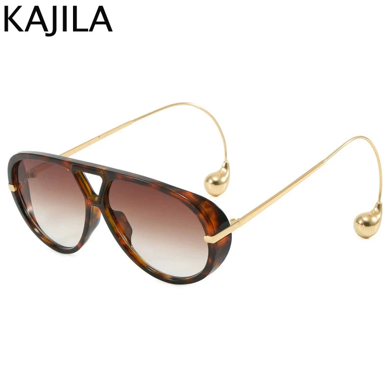 Gafas estilo aviador marrón tintadas con brazos y detalles de metal dorado