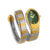 A gold-toned ladies watch with a snake design on the strap and a green face.