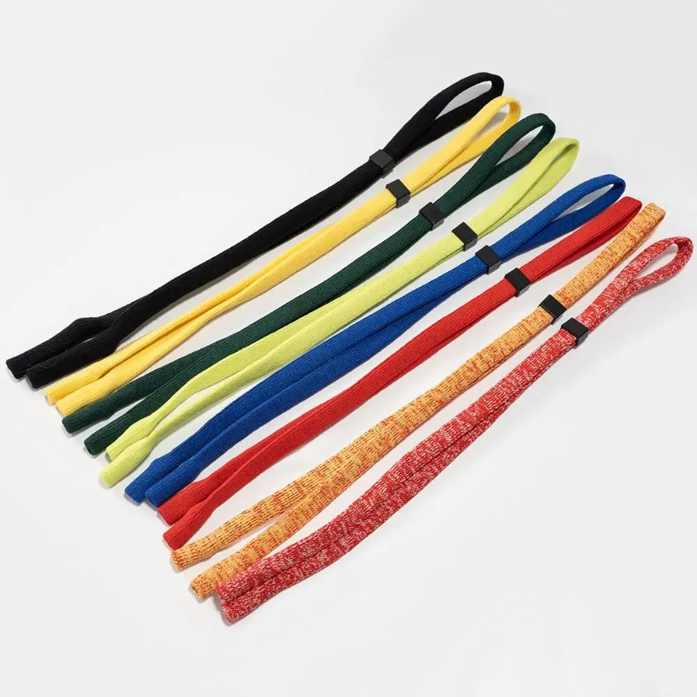 A collection of colorful adjustable eyewear lanyards or necklaces arranged diagonally.