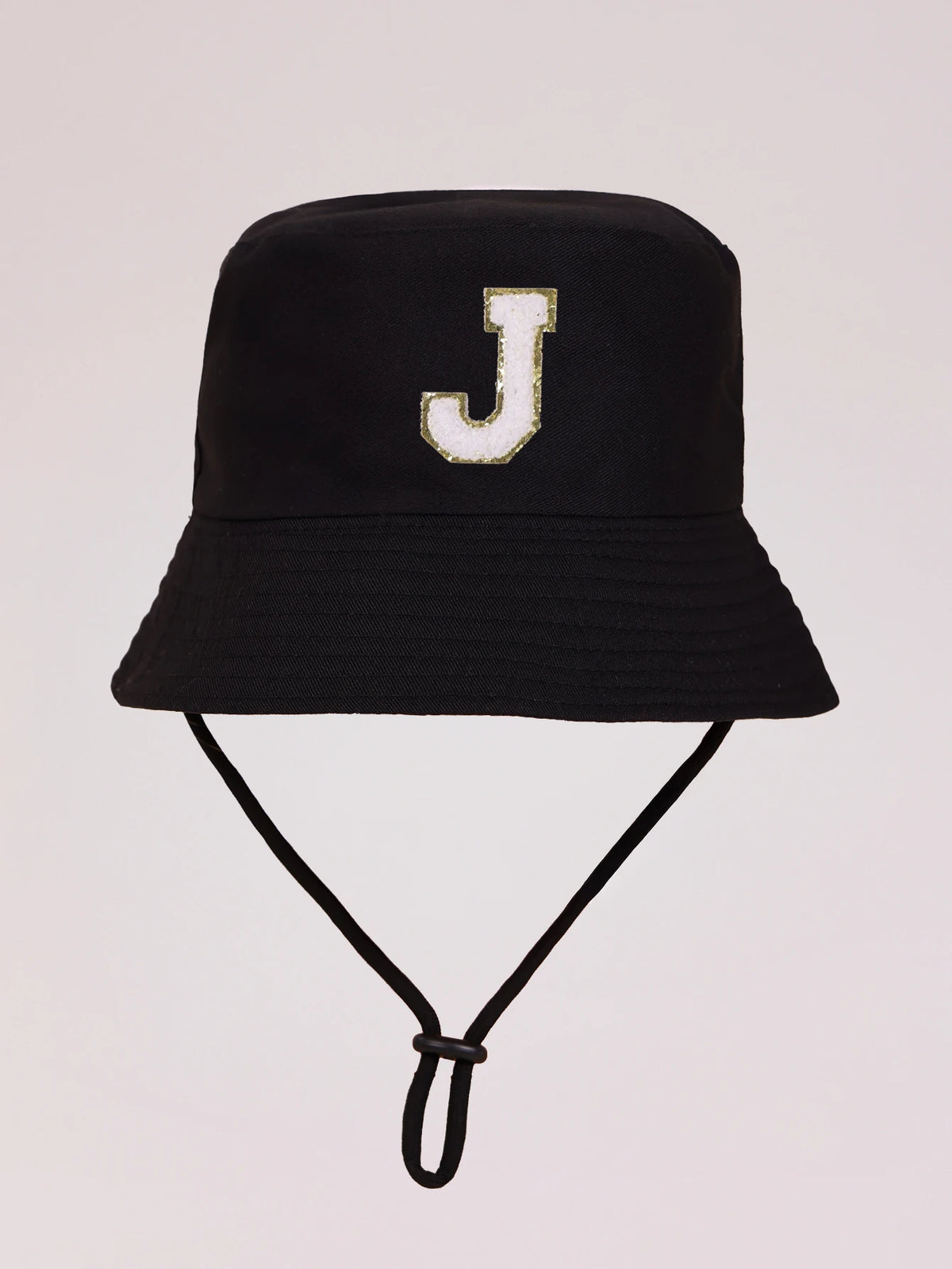 Black sun hat with a gold letter J embroidered on the front and an adjustable cord.