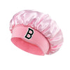 Pink satin hair cap with a black letter B print on the front
