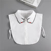 White blouse with a fashionable false collar neckline featuring black and red accents.