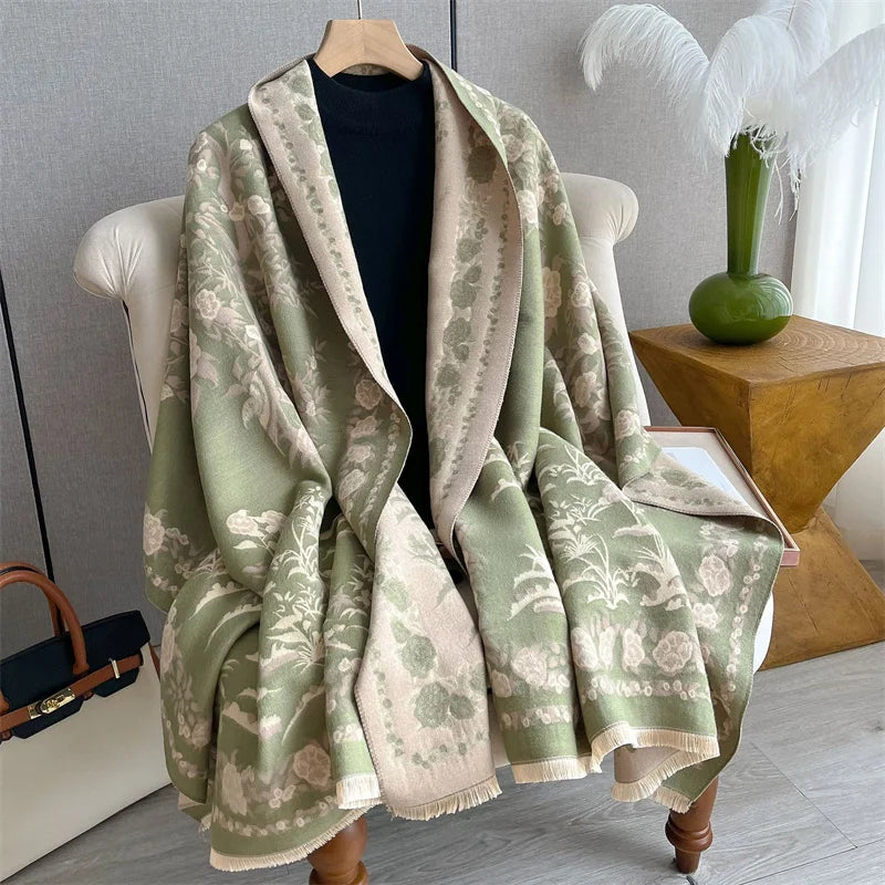 A light green and beige plaid cashmere scarf draped over a white chair.