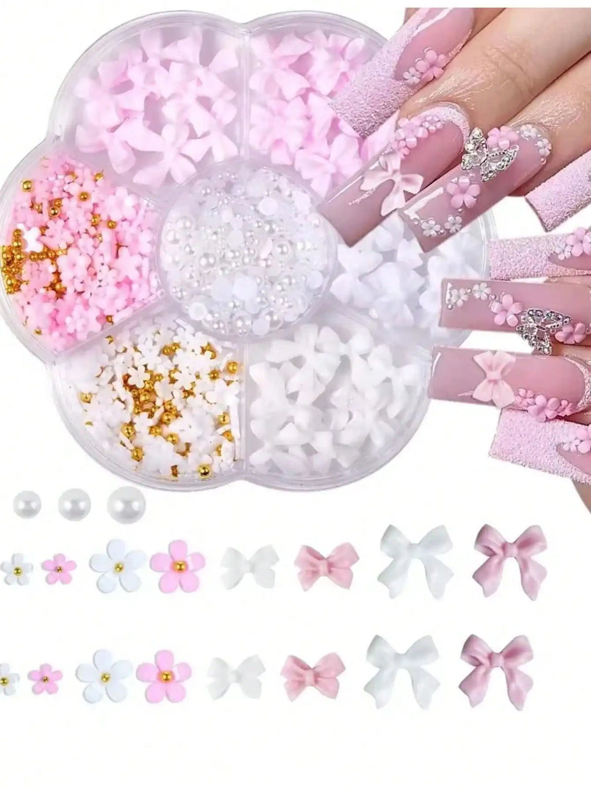 A clear plastic container holds various pink and white butterfly bow nail charms and glitter accents for manicures.