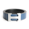 A silver leather dress belt buckle attached to a dark blue genuine leather belt.