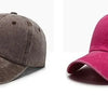 A pair of casual baseball caps, one dark gray and one magenta pink, shown side by side.