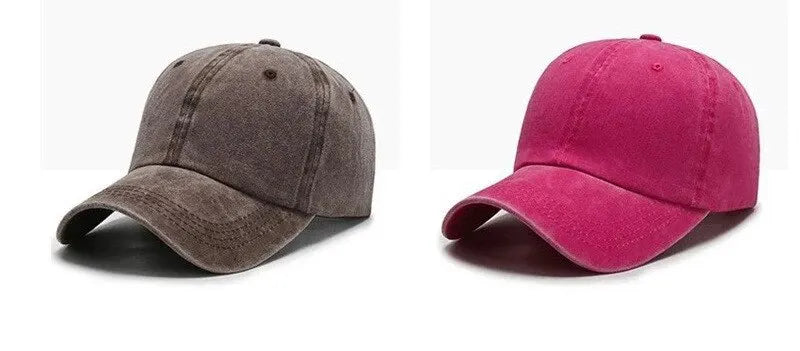 A pair of casual baseball caps, one dark gray and one magenta pink, shown side by side.