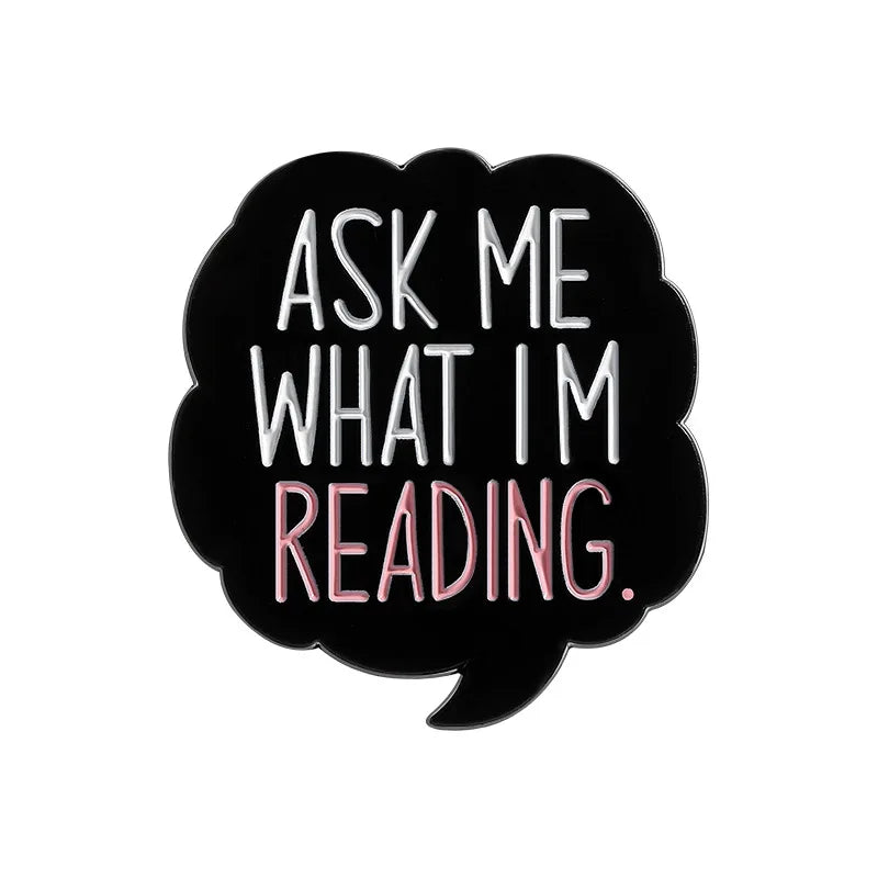 Black speech bubble with white text that reads Ask me what I'm reading.