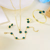 A set of five gold-toned bracelets featuring teal and green enamel plum blossom designs displayed on a light background.