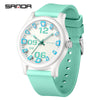 A white and teal digital watch with a light green silicone strap shown against a white background.