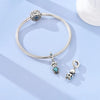 Sterling silver devil's eye charm bracelet with a round bead and various charms