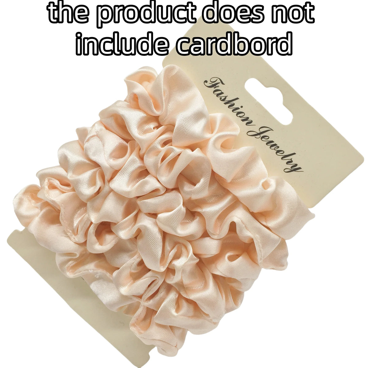 A pile of light pink satin hair scrunchies is shown on a cardboard tag.