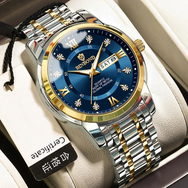 A silver and gold luxury quartz men's watch with a blue dial is displayed in a white presentation box.
