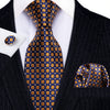 A men's silk jacquard tie set featuring a blue and gold checkered pattern worn with a black suit jacket.