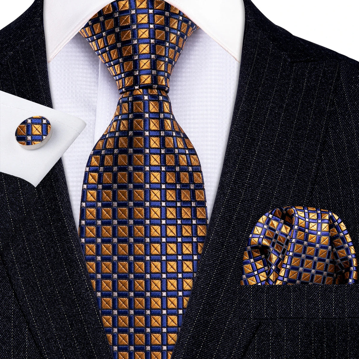 A men's silk jacquard tie set featuring a blue and gold checkered pattern worn with a black suit jacket.
