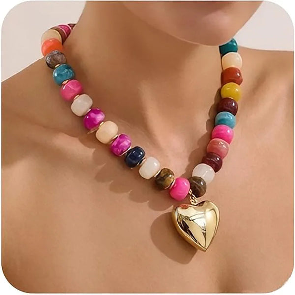 A colorful bohemian chunky resin heart choker necklace featuring various bead colors and a gold heart pendant.