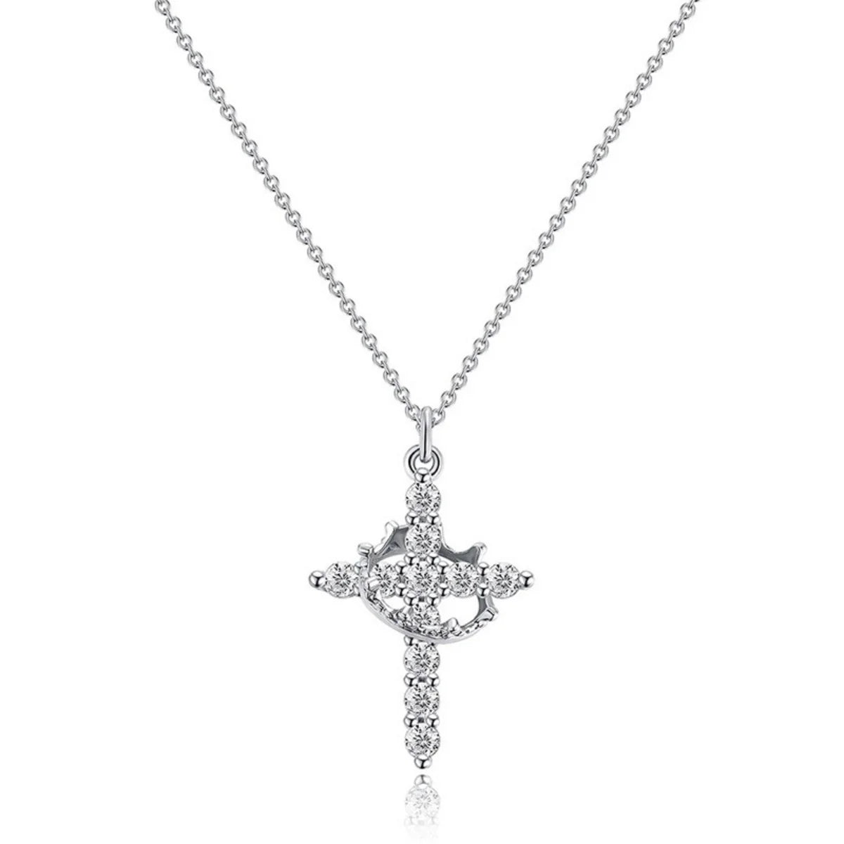 A silver stainless steel rotatable cross pendant necklace with a delicate chain.