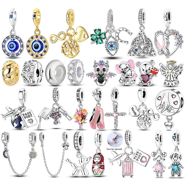 Sterling silver devil's eye charm bracelet featuring various charms and pendants
