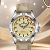 A close-up shot of a silver and beige retro men's watch with a light brown leather strap on a neutral background.