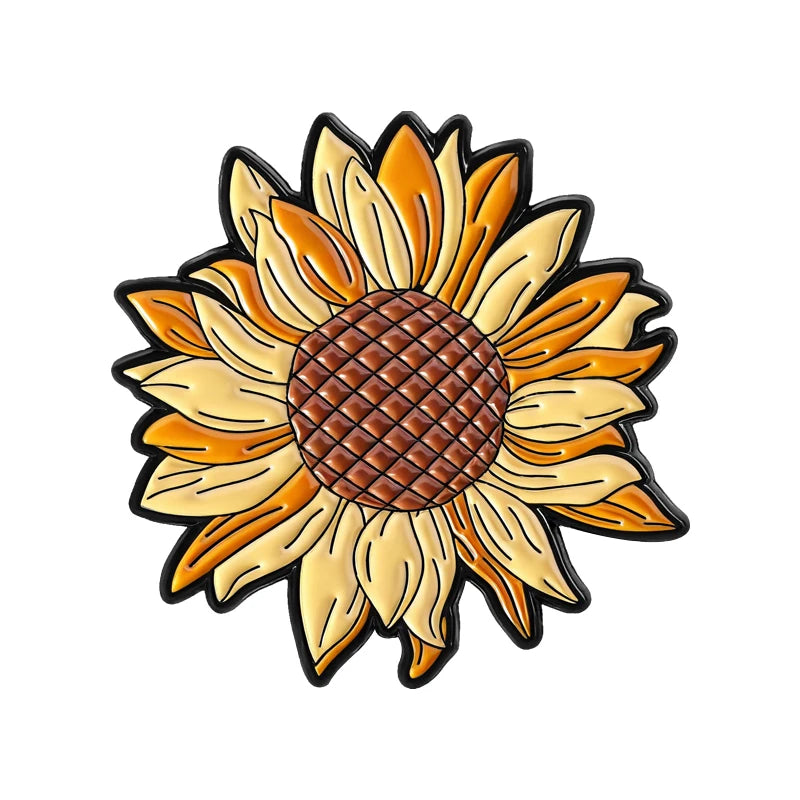 A detailed enamel flower brooch featuring a vibrant orange and yellow sunflower design.