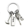 Silver multi-tool keychain set featuring a hammer and pliers.