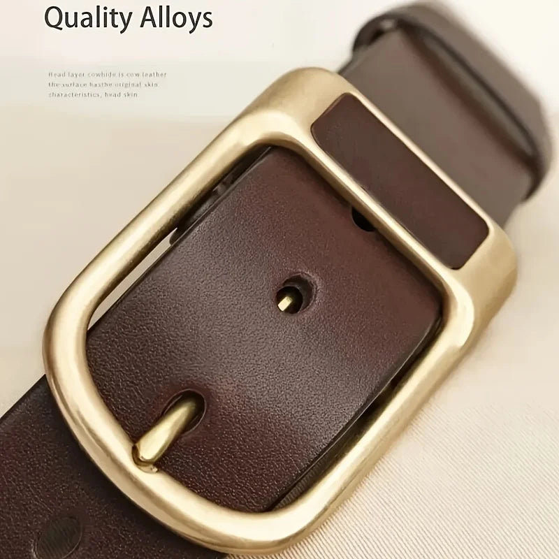 A close-up of a brown leather belt buckle and strap with a gold-toned finish.