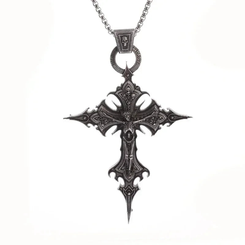 A dark metal retro Christian cross amulet necklace with a pendant and bail.