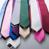 A collection of men's slim jacquard business ties in various shades of pink, blue, green, and purple.