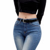 Black velvet long-sleeve top and blue denim jeans with a black belt
