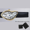 A gold-toned fashion quartz wristwatch with a heart-shaped dial and Roman numerals on a black leather strap, shown with its b
