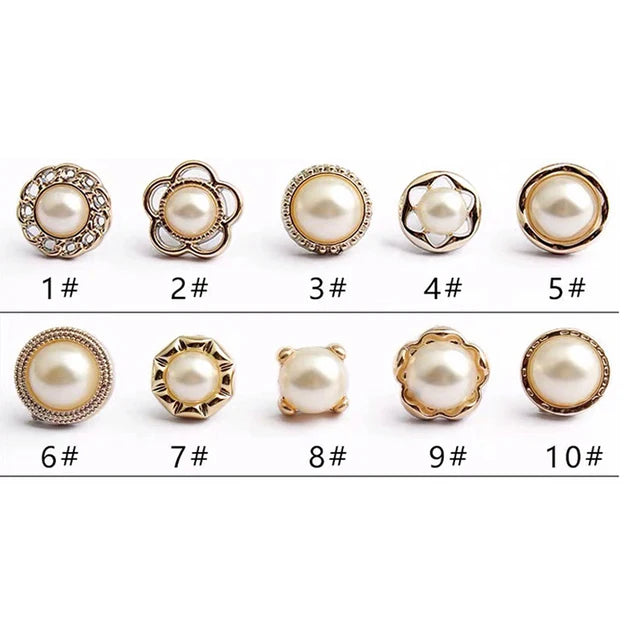 Ten button brooch pins featuring various sizes and styles of pearl-encrusted buttons.
