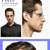 A close-up of a man wearing frameless diamond cut reading glasses while looking to the side.