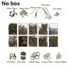 A collection of jewelry findings including clasps, hooks, jump rings, and various sizes in gold-toned metal.