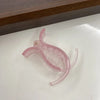 A clear pink acrylic hair claw designed for styling ponytails and hair.
