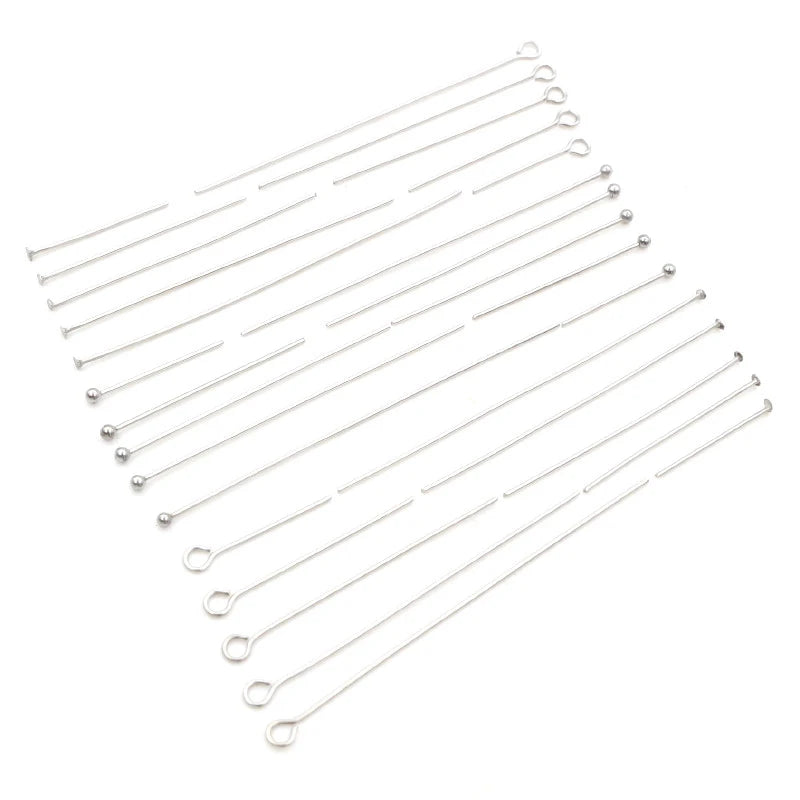 A collection of thin stainless steel ball pins arranged in parallel lines.