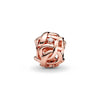 A close-up of a rose gold ring featuring an intertwined design and a clear diamond setting.