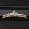 Gold-toned crystal rhinestone bridal tiara headpiece with a floral crown design.