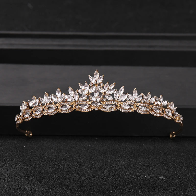 Gold-toned crystal rhinestone bridal tiara headpiece with a floral crown design.