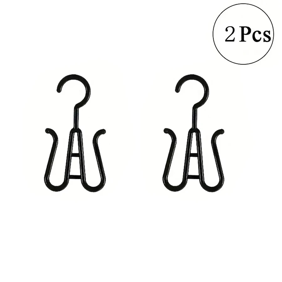 Two black multi-use wig and accessory hangers.
