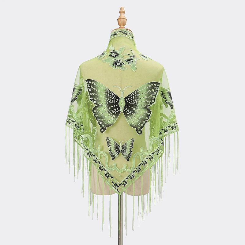 A sheer lime green printed butterfly lace scarf shawl with fringe details.