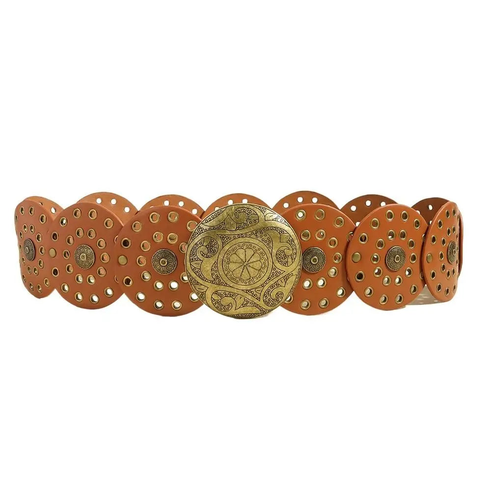 A set of vintage PU disc belts with metal buckles, featuring a copper-toned material and brass accents.