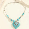 Collier en argent avec des perles de turquoise et un pendentif en forme de cœur en turquoise