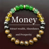 A bracelet featuring green, yellow, and brown polished stones used to attract wealth, abundance, and prosperity.